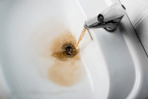 Backflow pouring out of sink