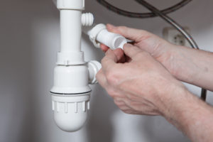 Man performing plumbing repair