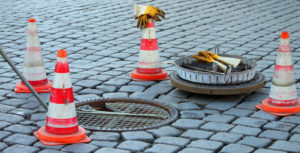 Sewer cleaning being performed in sewer