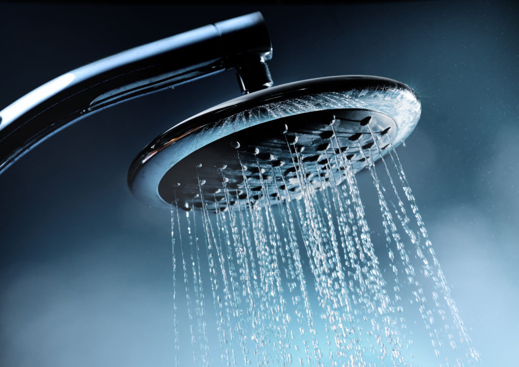 A shower head with hot water and steam