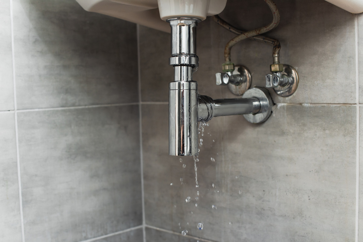 A leaking pipe under a sink in El Paso.